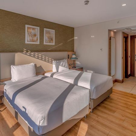 Doubletree By Hilton Antalya City Centre Экстерьер фото A room at the hotel