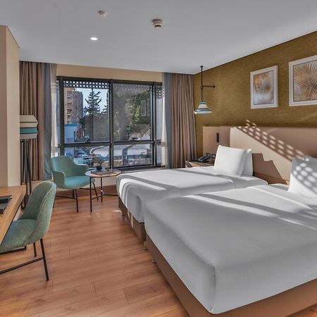 Doubletree By Hilton Antalya City Centre Экстерьер фото A room at the hotel