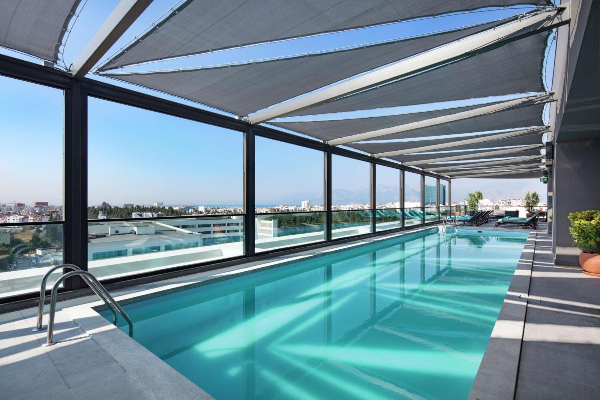 Doubletree By Hilton Antalya City Centre Экстерьер фото The rooftop pool